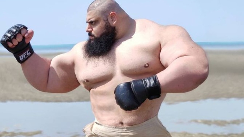 Ο Ιρανός Hulk προετοιμάζεται για αγώνα λυγίζοντας τηγάνια και ρίχνοντας μπουνιές σε τοίχο (vid)